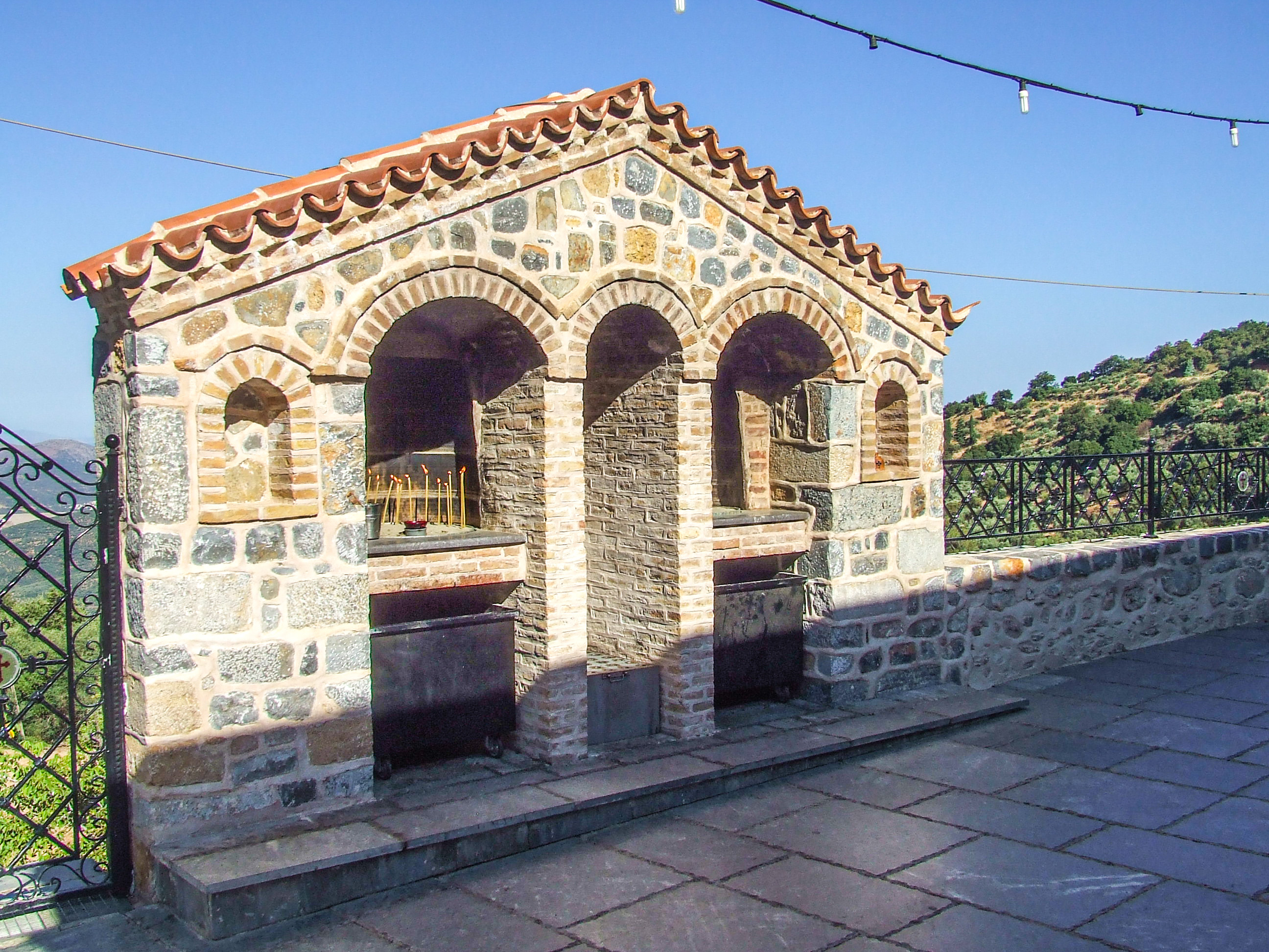 stone platform with a scenic view of hills and greenery